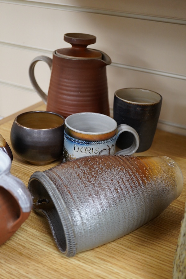 Guy Sydenham (1916-2005), studio pottery comprising a wall pocket, two jugs, Doris (sister-in-law) mug, coffee pot and cover, and a beaker, largest 19cm high